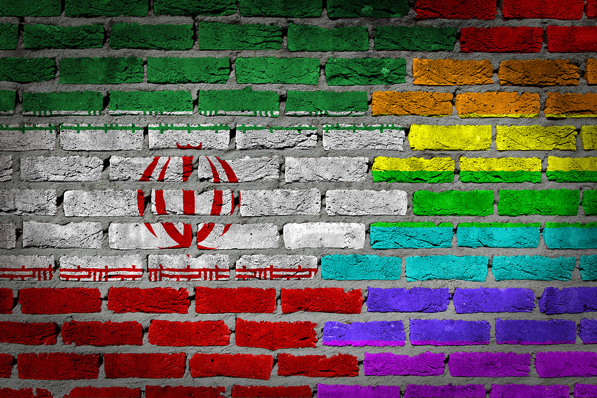 iran_flag_and_rainbow_painted_on_brick_wall_illustration_insert_by_micha_klootwijk_via_bigstock